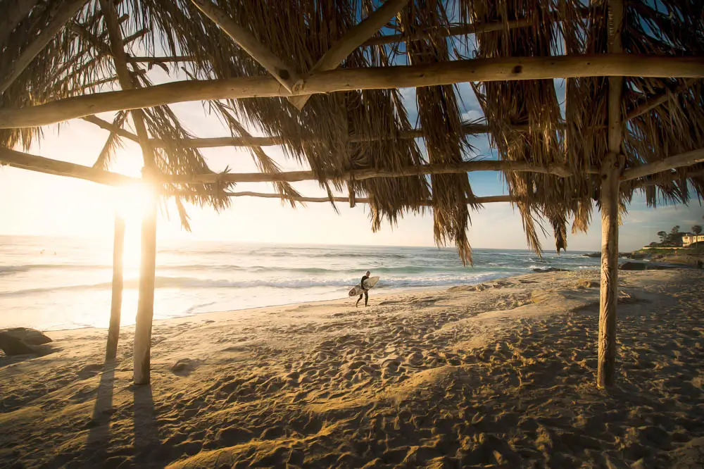 Surfer on the beach in Hawaii